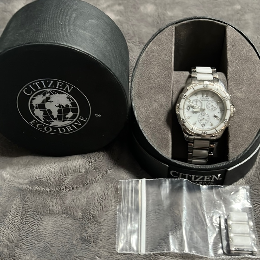 Citizens Eco-Drive Woman’s watch with white face with additional links.